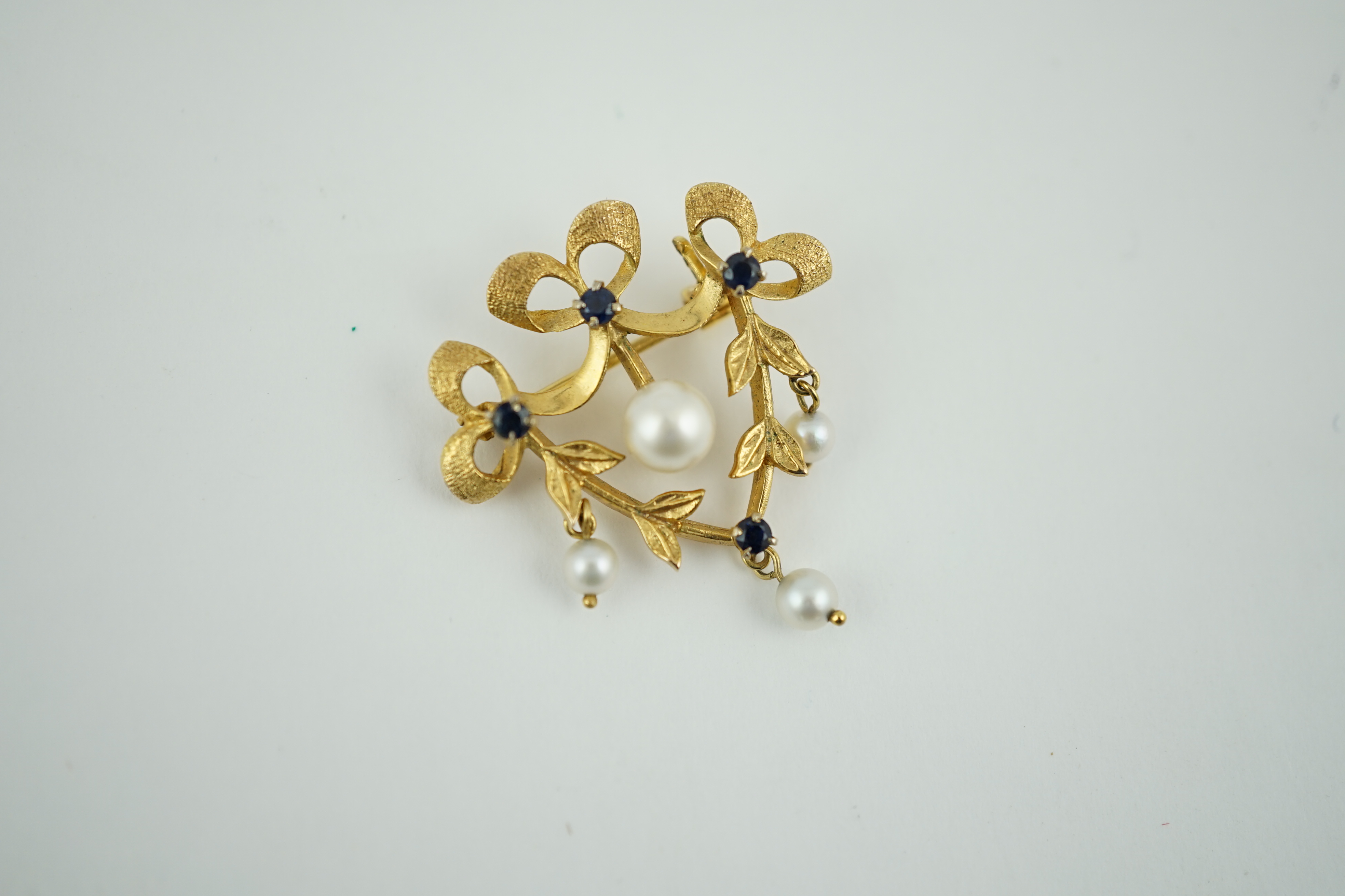 A modern 9ct gold, sapphire and cultured pearl set drop brooch